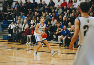 Cooper Boike, 17, of Flint, Mich. on the basketball court after his first cornea transplant.
