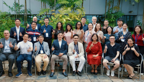 Eversight Global team and international partners sitting in chairs