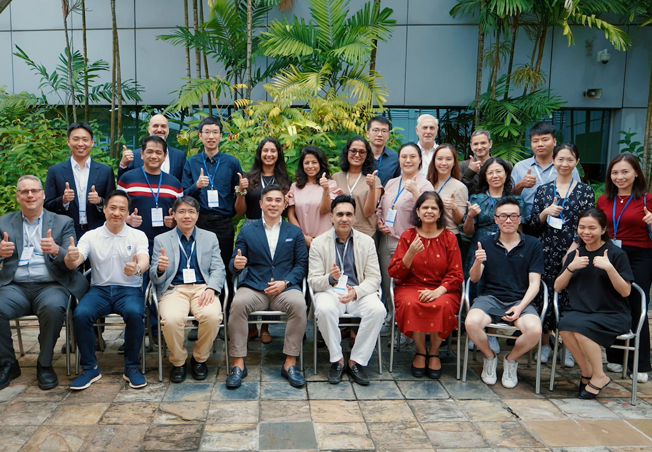 Eversight Global team and international partners sitting in chairs