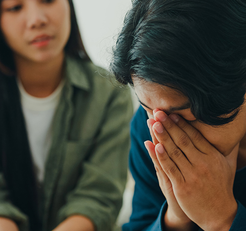 Grieving man with support